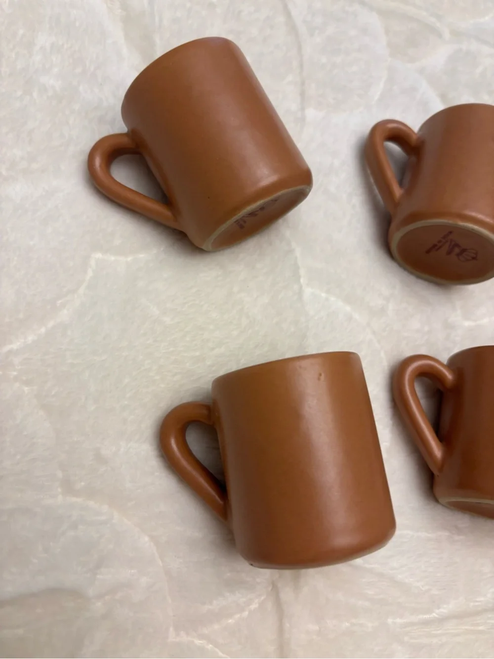 Four brown stoneware pottery expresso shot coffee mugs